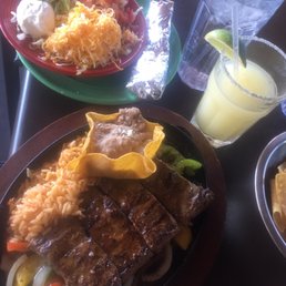 Salsa on the Rock Fresh Mexican Grill signature dishes Steak FajitasSurf and Turf BurritoCarne Asada